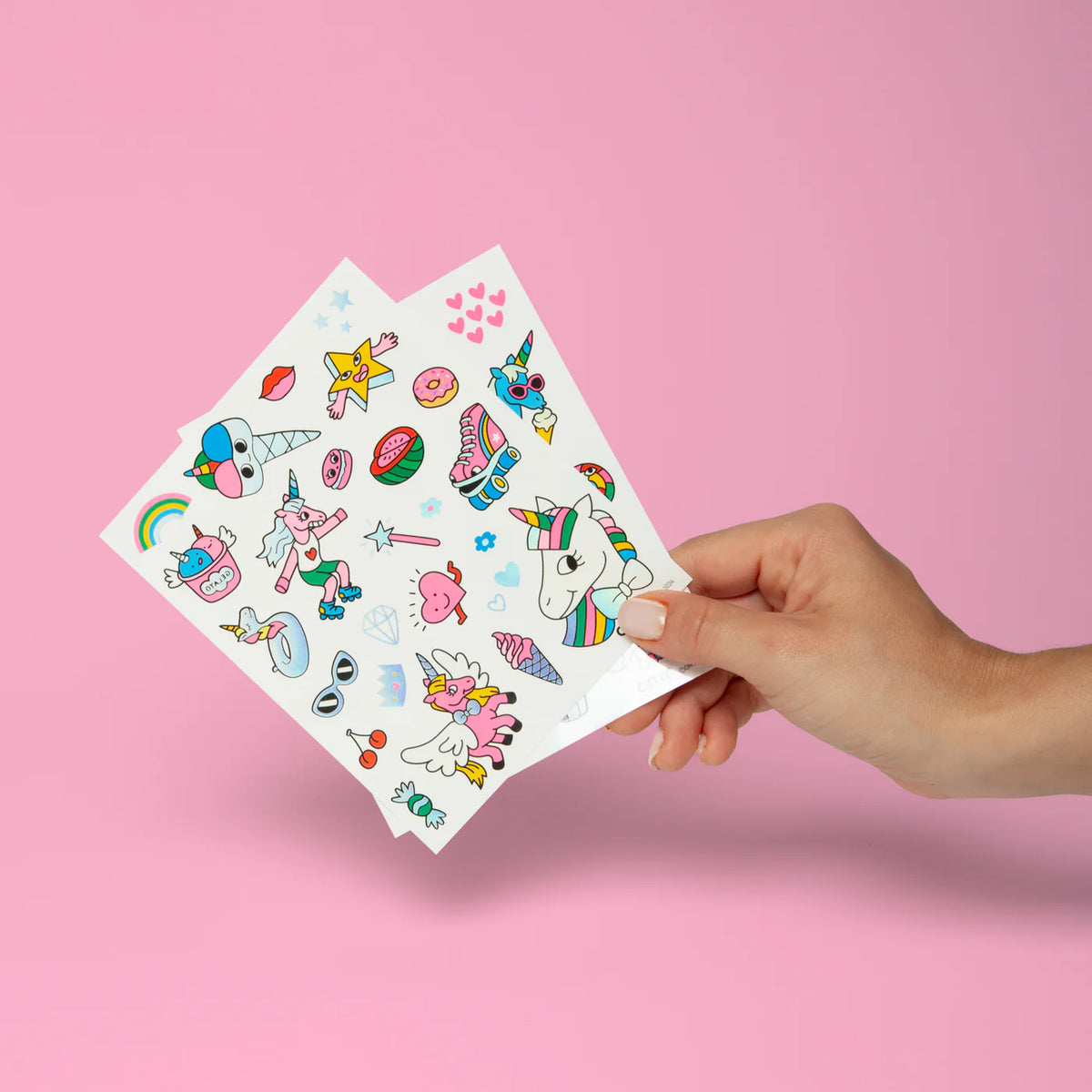 Pack of temporary tattoos with a unicorn design on a white background