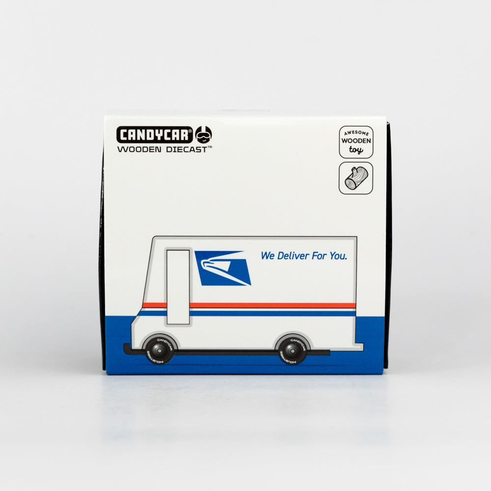 Box packaging of a wooden diecast model truck with USPS design on a white background
