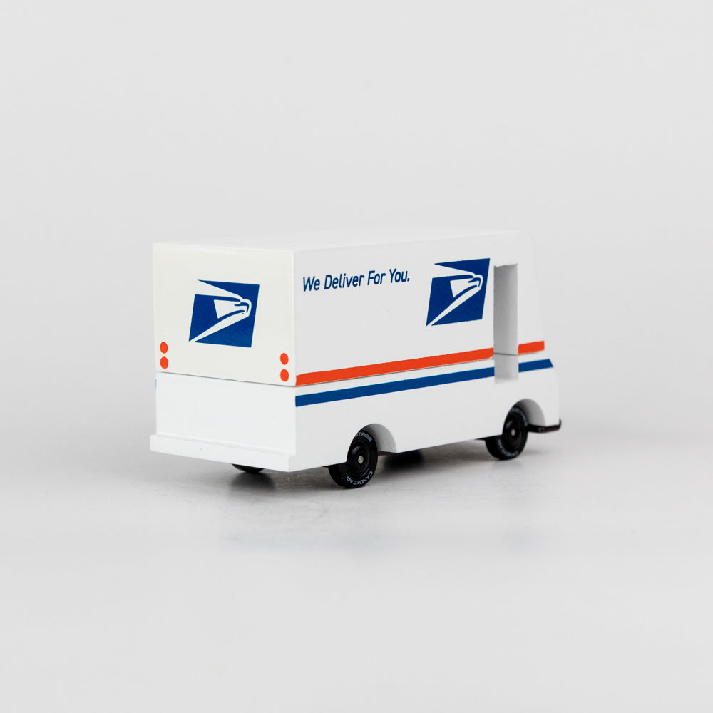 Model of a USPS delivery truck on a white background
