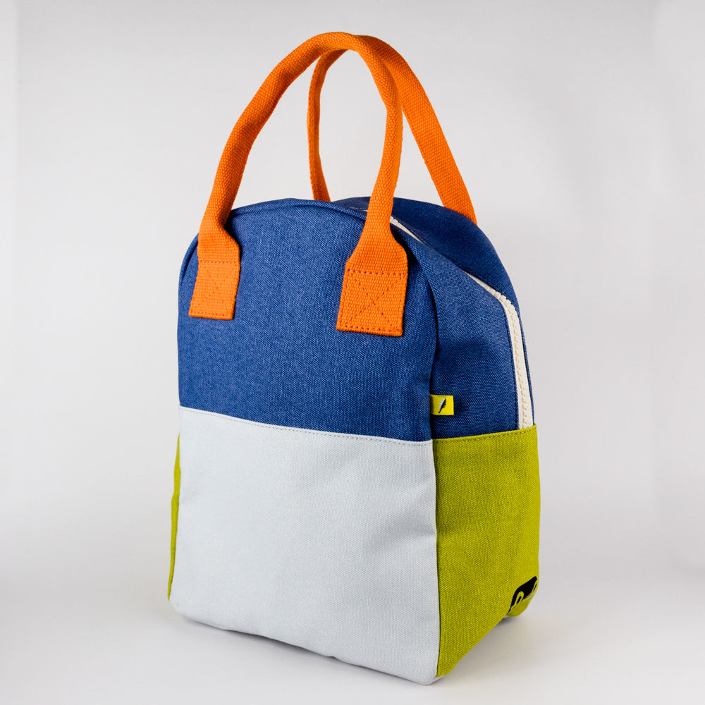 Colorful bag with orange handles on a white background
