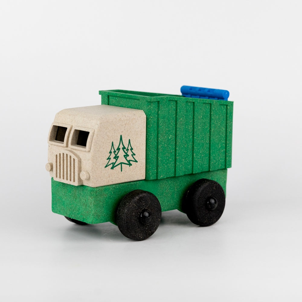 Toy truck with green body and beige front on a white background