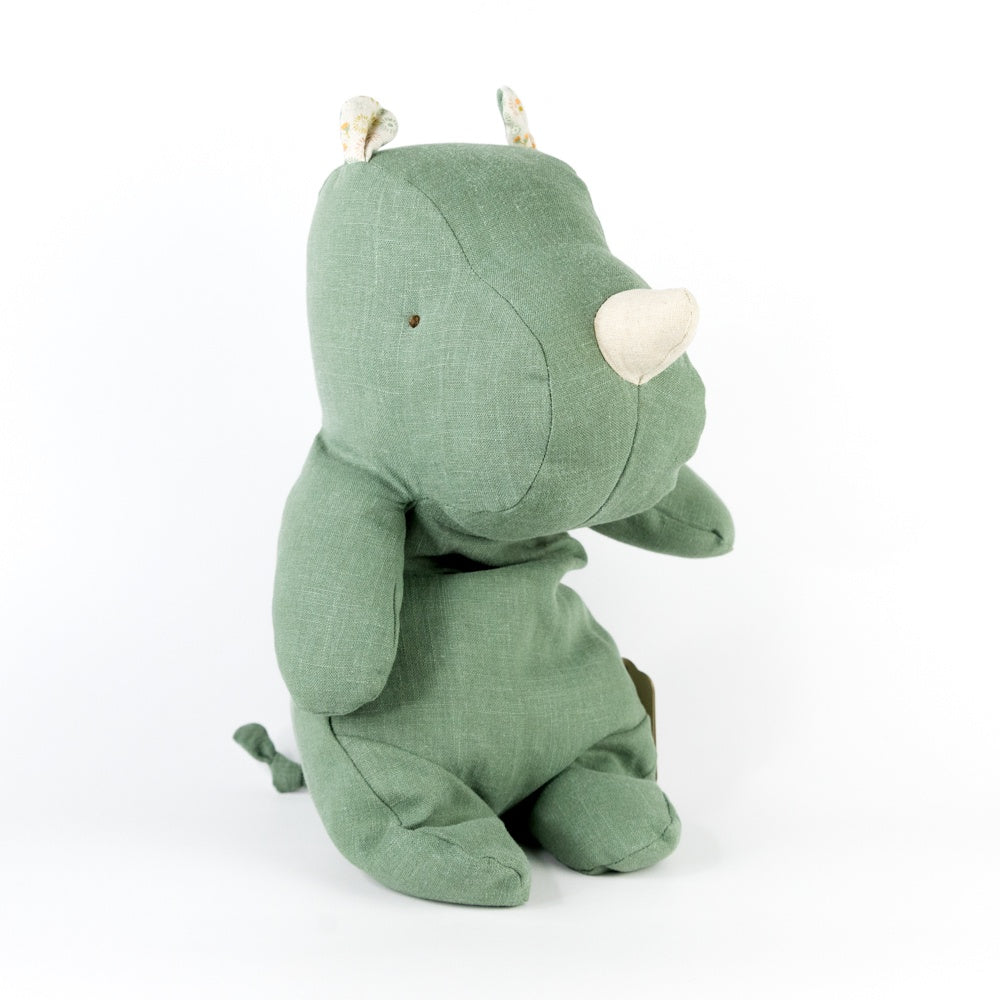 Green plush toy on a white background