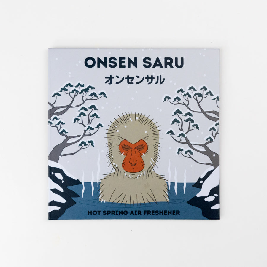 Round hanging flat disc with a monkey illustration and text on a white background