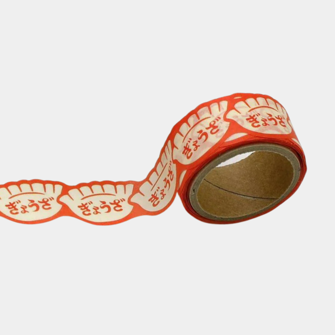 Small roll of red patterned tape with red label on a white background