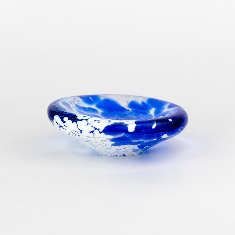 Blue and white glass bowl on a light gray background